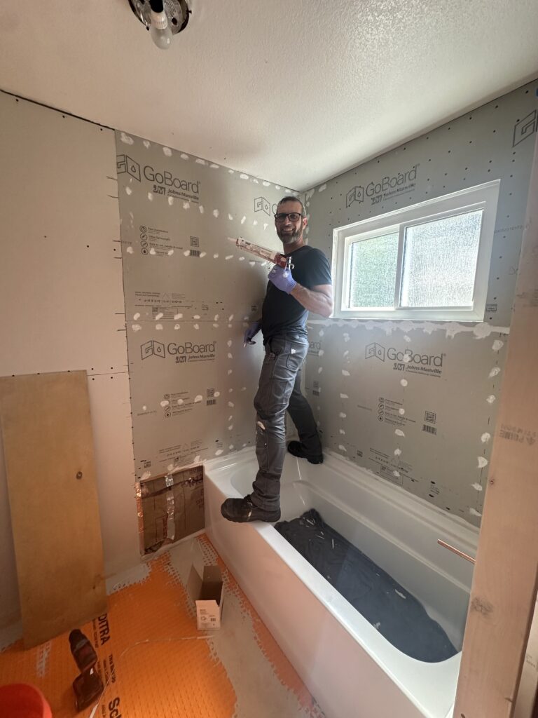 Gabriel working on a bathroom remodel project for GMP Plumbing