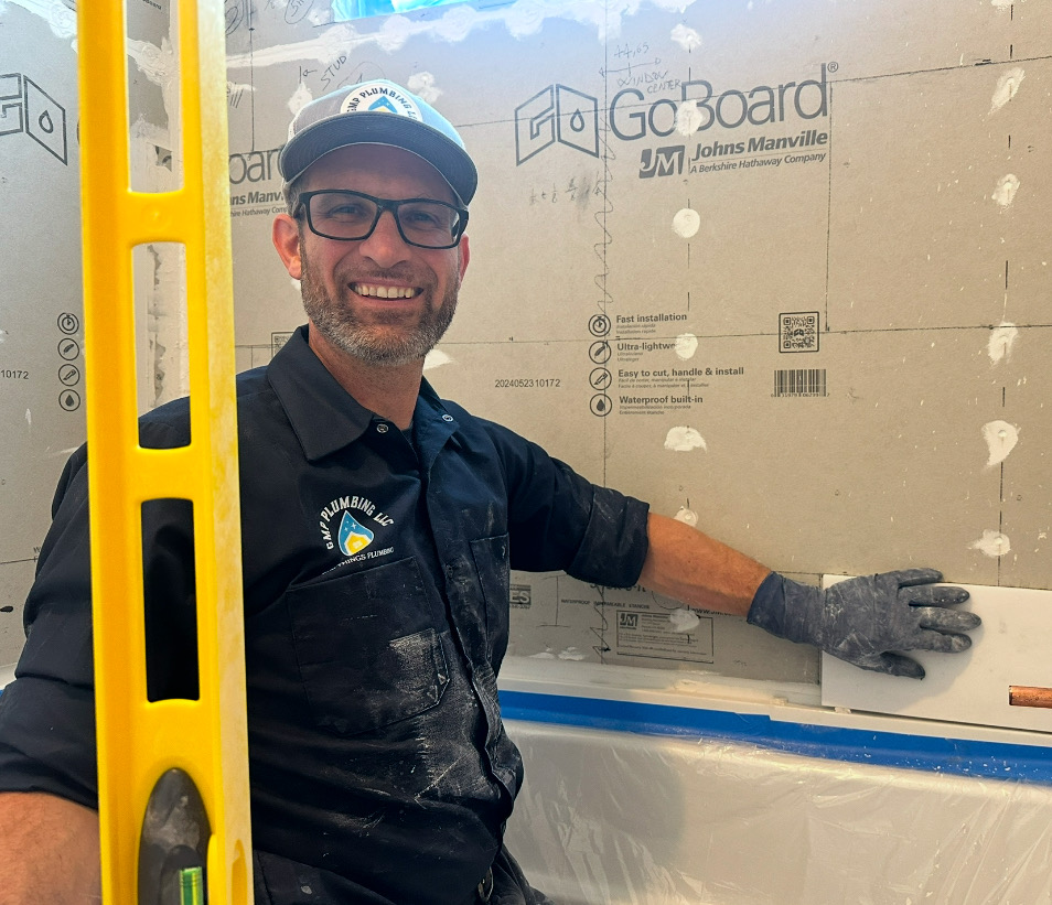 Gabriel working on finishing up a bathrrom remodel